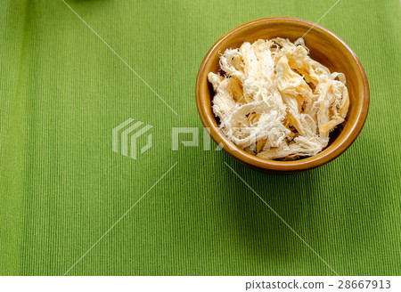 close up in dried squid on green  background 28667913