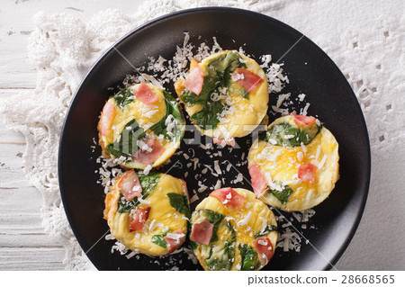frittata with spinach, ham and cheese on a plate 28668565