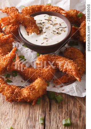Delicious fried shrimp in coconut chips Delicious fried shrimp in coconut chips 28668608
