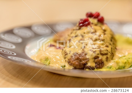 Meat patties or frikadeller in sauce Meat patties or frikadeller in sauce 28673124
