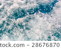 Sea waves bubble foam from boat 28676870