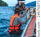 Woman preparing to snorkel dive with life jacket 28676873