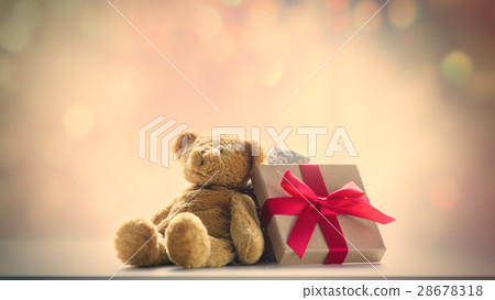cute teddy bear and beautiful gift on the fairy lights bokeh bac cute teddy bear and beautiful gift on the fairy lights bokeh bac 28678318