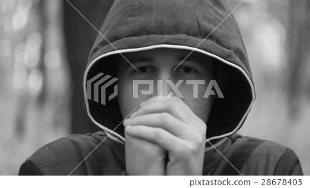 the young man warming his hands 28678403
