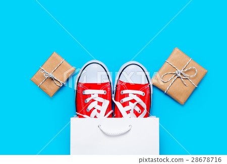 big red gumshoes in cool shopping bag 28678716