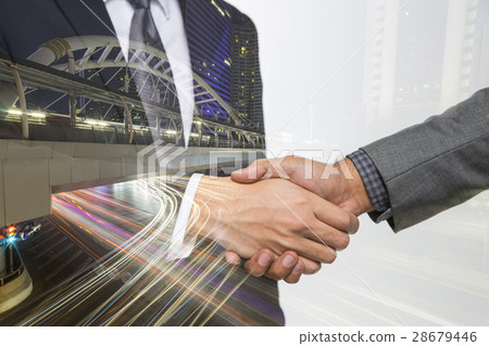 Double exposure of Business handshake. Double exposure of Business handshake. 28679446