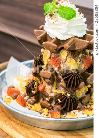 Waffle chocolate ice cream with topping fruits 28682884