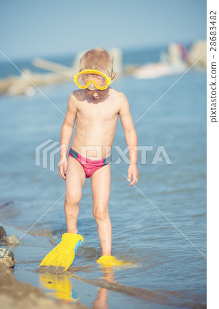 Cute little kid wearing mask and flippers for 28683482