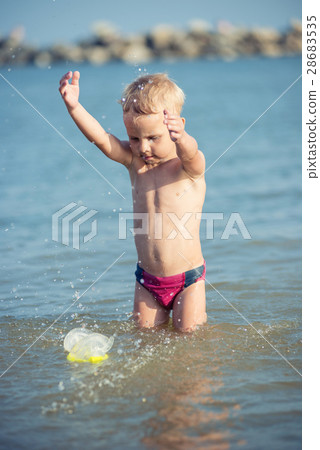 Cute little kid wearing mask and flippers for Cute little kid wearing mask and flippers for 28683535