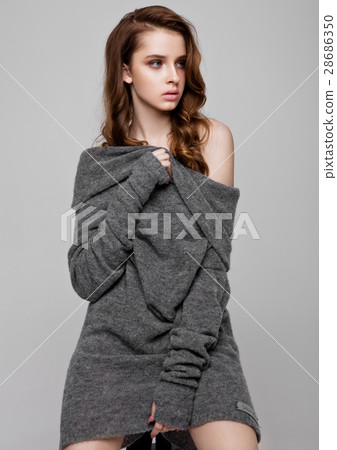 Young beautiful fashion model wearing knitwear Young beautiful fashion model wearing knitwear 28686350