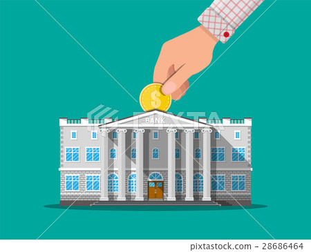 Hand putting coin into bank building 28686464