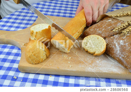 Cutting White and Dark Bread 28686568
