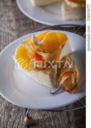 Cheesecake decorated with oranges and physalis Cheesecake decorated with oranges and physalis 28691677