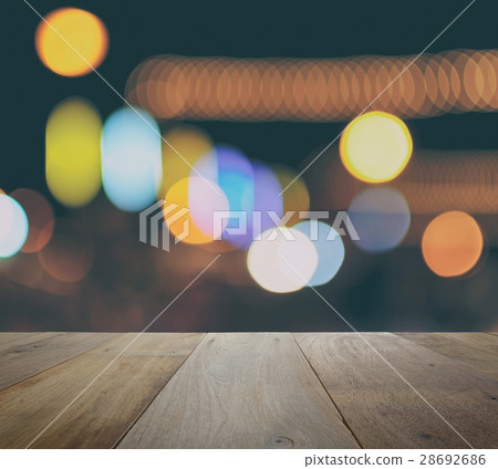 wood table top on abstract bokeh lights 28692686