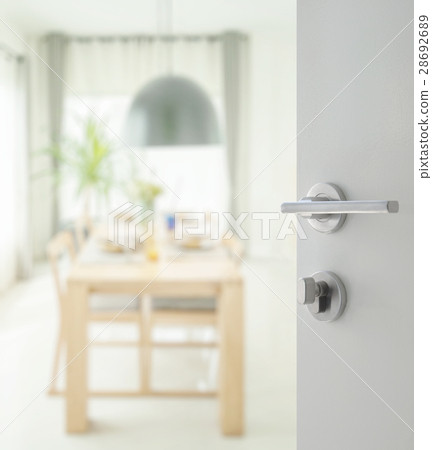 opened door to dining table and comfortable chairs opened door to dining table and comfortable chairs 28692689
