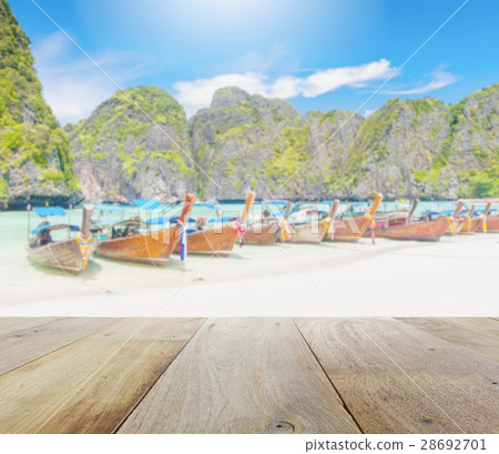 wooden platform with long tail boat on beach 28692701