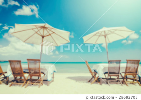 blurred table set and umbrella on the beach blurred table set and umbrella on the beach 28692703