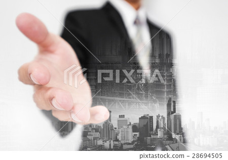 Businessman stretch out hand, with double exposure 28694505