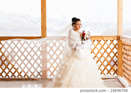 Young bride with the flower bouquet in winter time 28696706