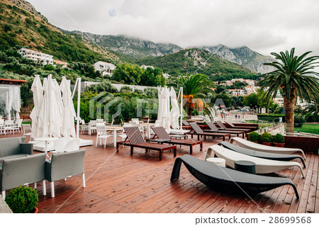 cafe with sunbeds and mountain view 28699568