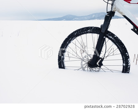 Bike in powder snow. Lost in deep snowdrift. Bike in powder snow. Lost in deep snowdrift. 28702928