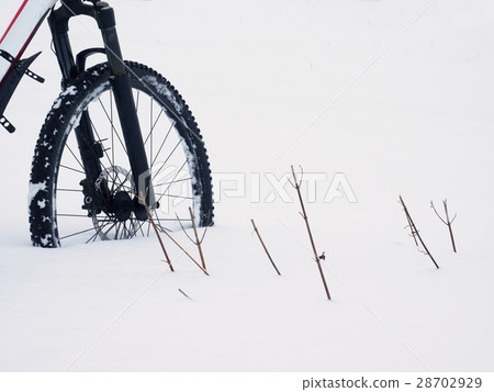 Bike in powder snow. Lost in deep snowdrift. 28702929