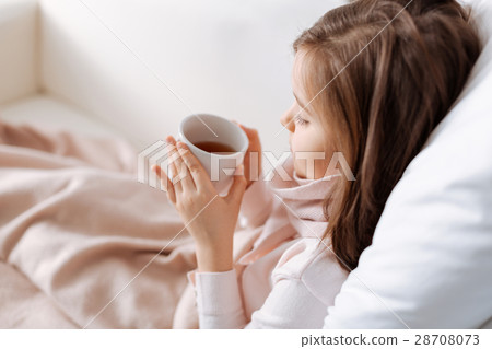 Pleasant il lttle girl resting at home Pleasant il lttle girl resting at home 28708073