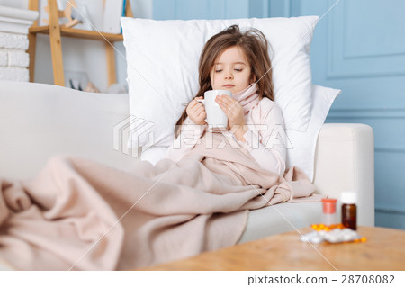 Sick pleasant girl lying on the sofa 28708082