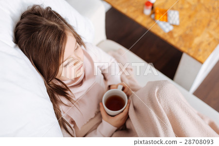 Pleasant ill girl suffering from cold Pleasant ill girl suffering from cold 28708093