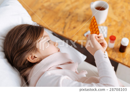 Little ill girl taking pills Little ill girl taking pills 28708103