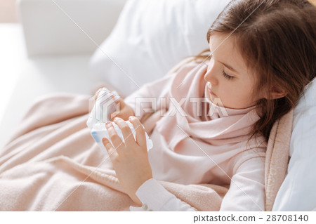 Sick little girl taking pills Sick little girl taking pills 28708140
