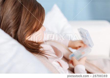 Sick little girl resting at home Sick little girl resting at home 28708169