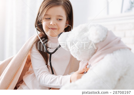Positive little girl pretending to be a doctor Positive little girl pretending to be a doctor 28708197