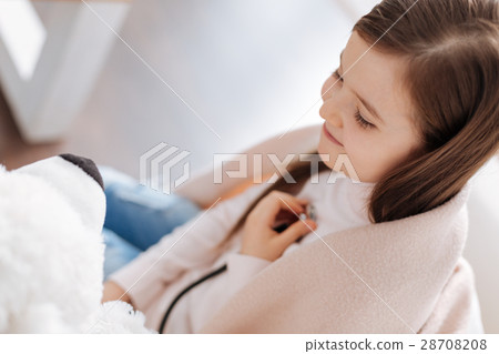 Cheerful little girl playing at home Cheerful little girl playing at home 28708208