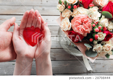 Red glass heart in woman hands. top view Red glass heart in woman hands. top view 28708444