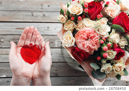 Red glass heart in woman hands. top view Red glass heart in woman hands. top view 28708450