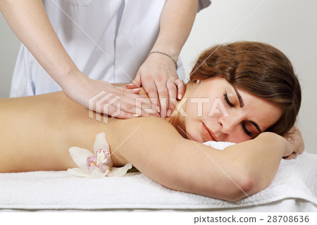 Woman receiving a back massage Woman receiving a back massage 28708636