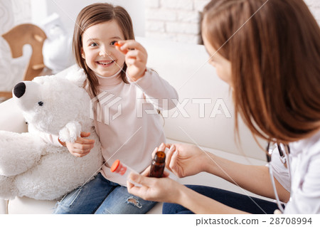 Joyful cute girl taking pills Joyful cute girl taking pills 28708994
