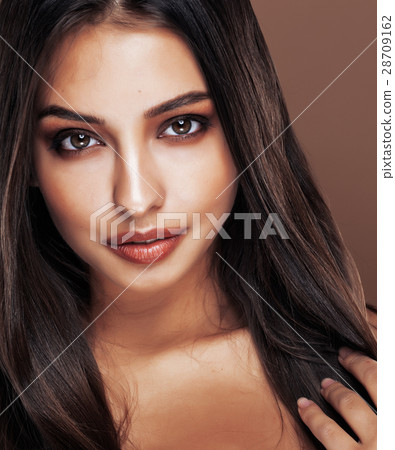 cute happy young indian woman in studio close up cute happy young indian woman in studio close up 28709162