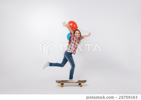 Talented little child skateboarding in the studio Talented little child skateboarding in the studio 28709163