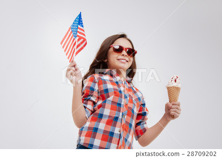 Sanguine little girl celebrating American national Sanguine little girl celebrating American national 28709202