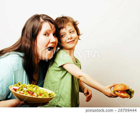 fat woman holding salad and little cute boy with 28709444