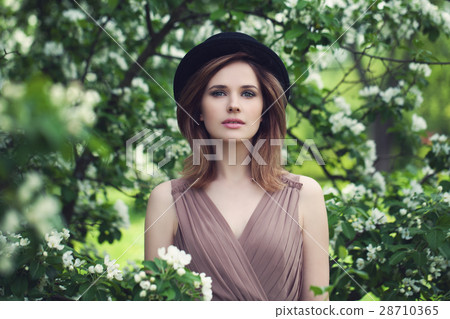 Pretty Woman on Floral Background. Spring Beauty 28710365