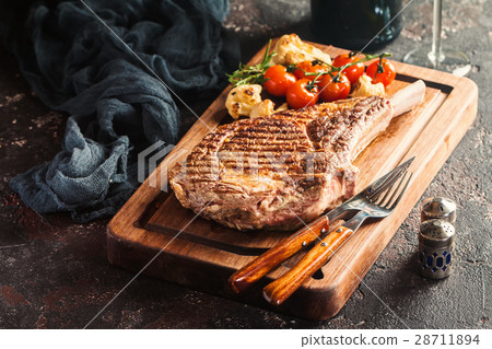 grilled tomahawk beef steak 28711894
