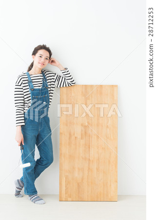 A woman wearing overalls DIY 28712253