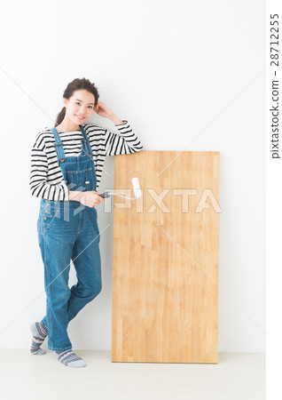 A woman wearing overalls DIY 28712255