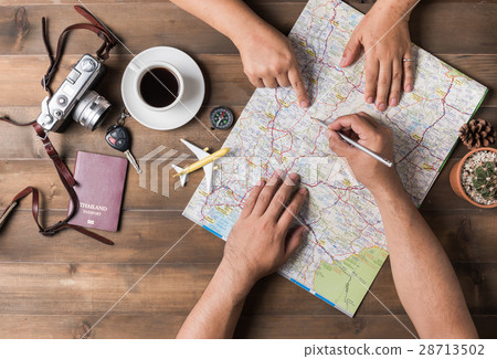 Young couple planning  vacation trip with map 28713502