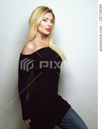 Beautiful blonde girl in a black dress. A variety 28714084