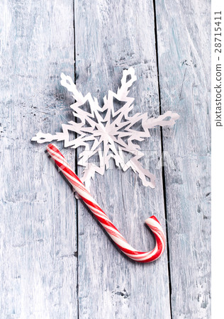 Candy cane and handmade paper snowflake 28715411
