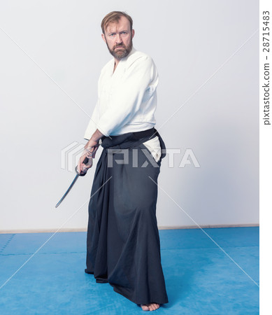 A man with katana is ready to attack 28715483